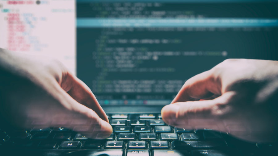 Hands on keyboard typing code, hacker,
