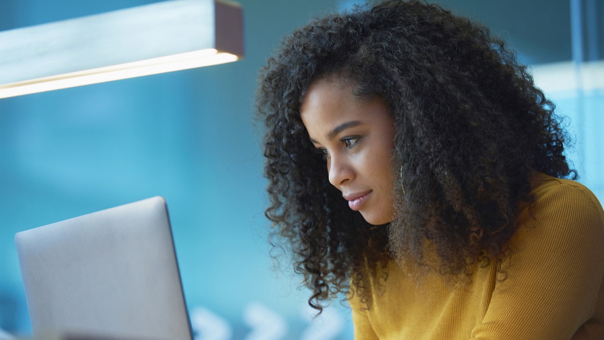 young woman on laptop in office