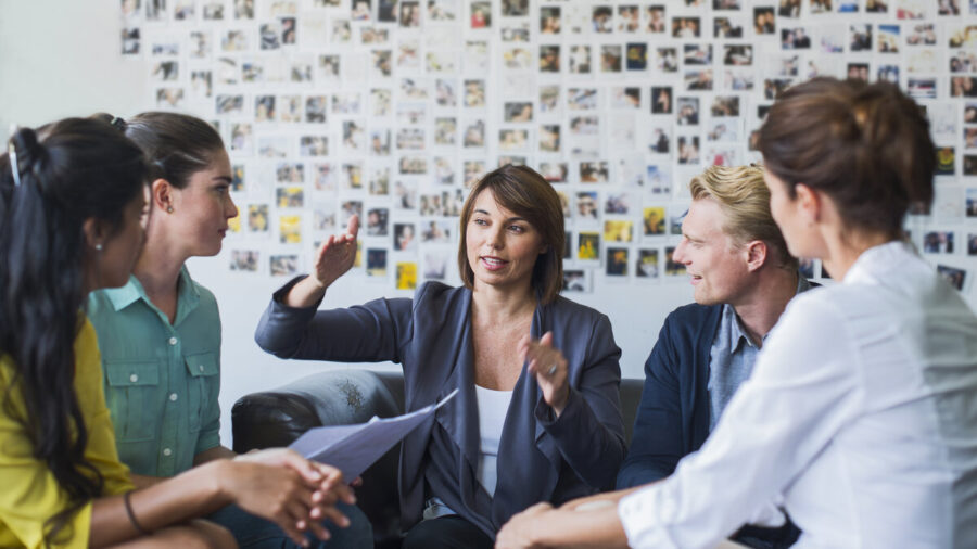 Businesswoman leading a meeting with her peers