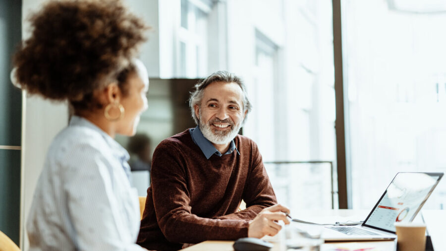 Employees conversing in a modern office