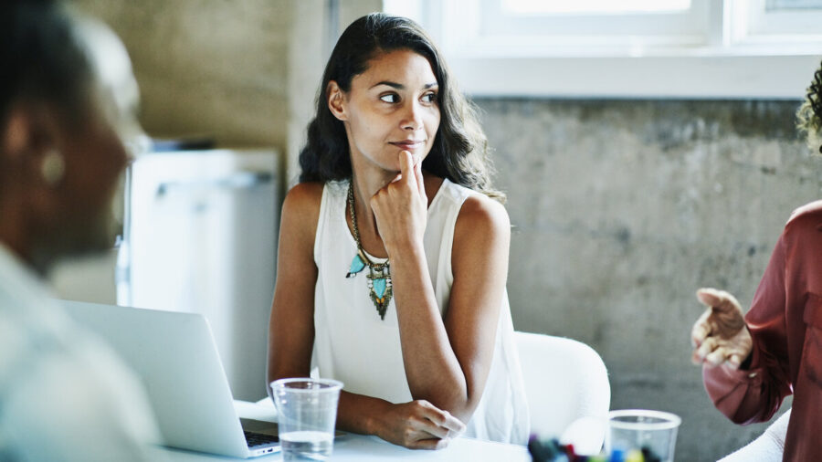 Young businesswoman in a meeting with colleagues